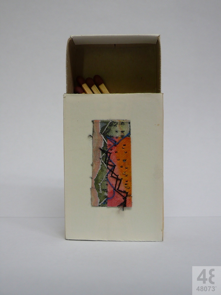 Small abstract painting on matchbox.