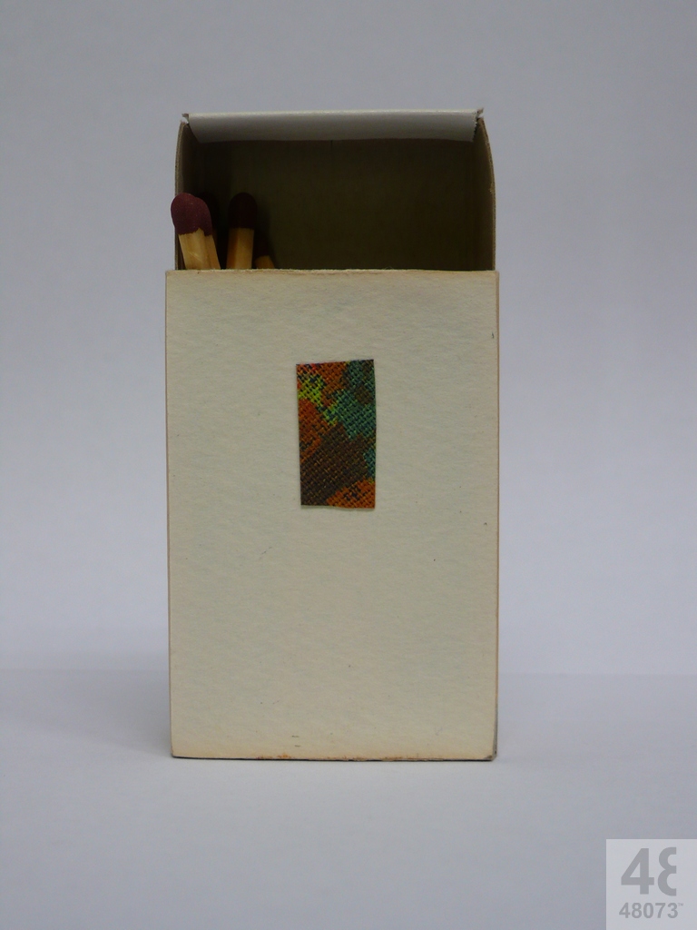 Small abstract painting on matchbox.