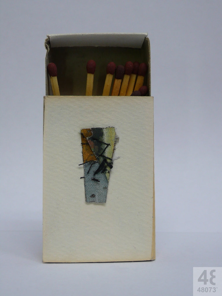 Small abstract painting on matchbox.