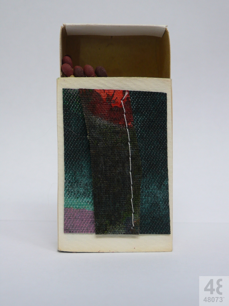 Small abstract painting on matchbox.