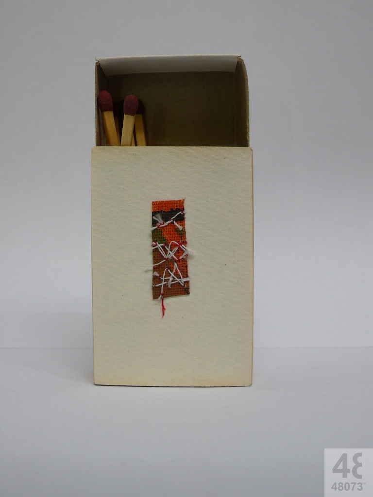 Small abstract painting on matchbox.