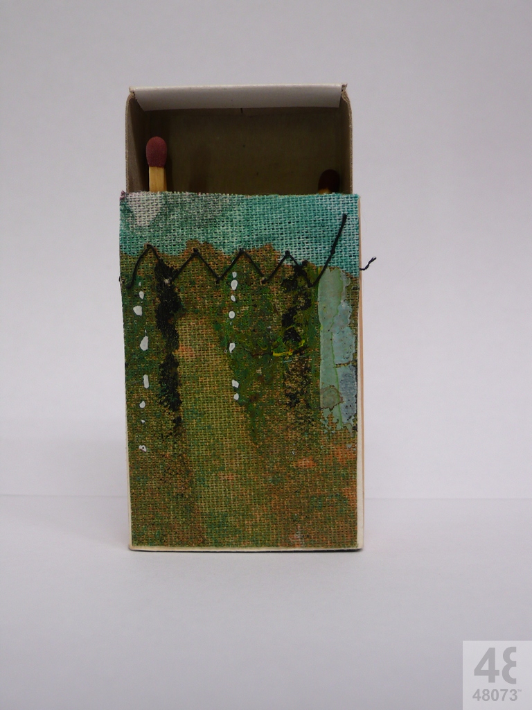 Small abstract painting on matchbox.