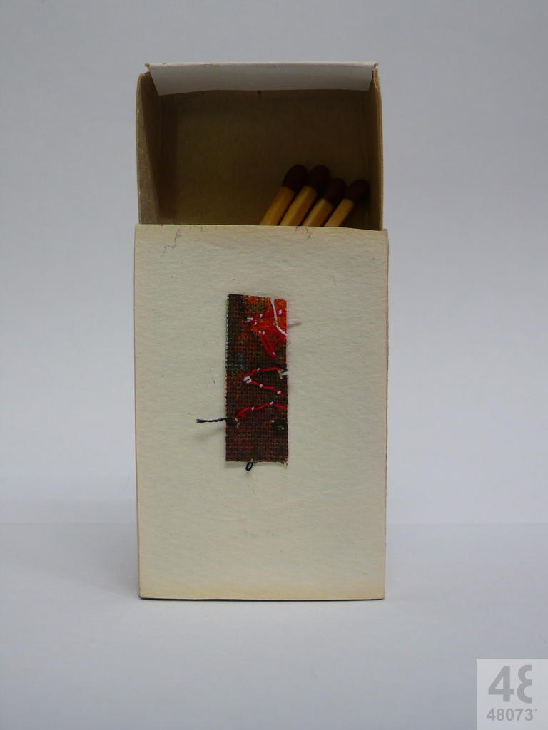 Small abstract painting on matchbox.