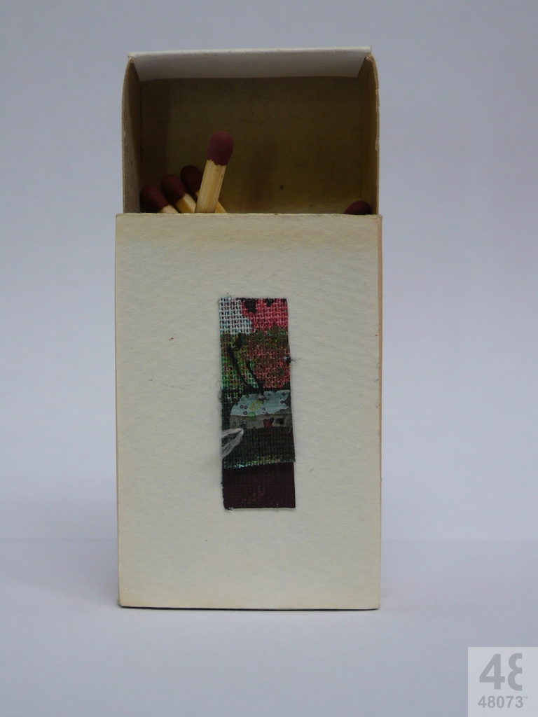 Small abstract painting on matchbox.