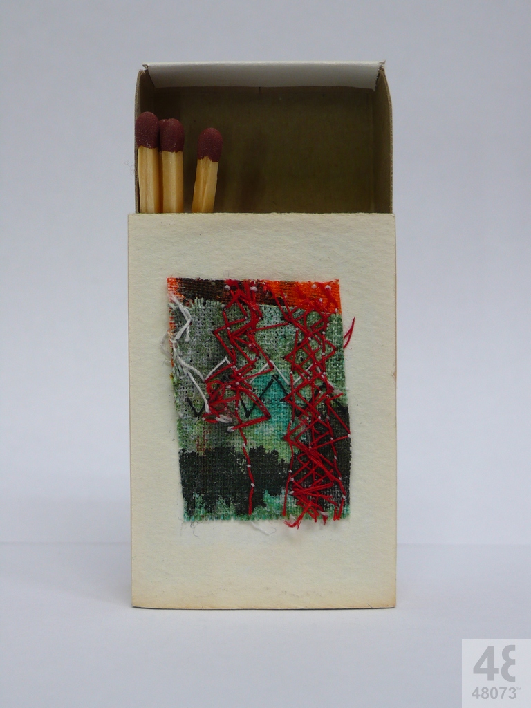 Small abstract painting on matchbox.